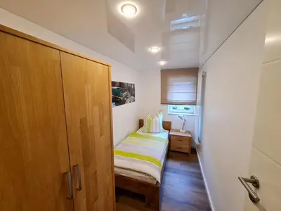 Ein Bett oder Betten in einem Zimmer der Unterkunft Apartment-1 Rödermark