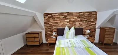 Ein Bett oder Betten in einem Zimmer der Unterkunft Apartment-1 Rödermark