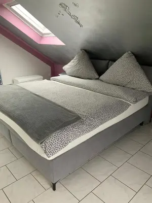 Ein Bett oder Betten in einem Zimmer der Unterkunft Herz der Weinberge