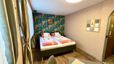 Ein Bett oder Betten in einem Zimmer der Unterkunft Gästehaus Grüner Baum