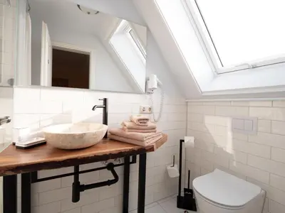 Ein Badezimmer in der Unterkunft REFUGIUM Theresienstraße 19 - Chambre Vonnoh