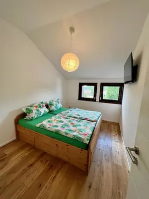 Ein Bett oder Betten in einem Zimmer der Unterkunft Ferienhaus Fuchseck