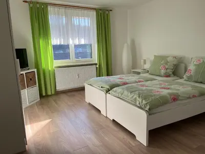 Ein Bett oder Betten in einem Zimmer der Unterkunft Ferienwohnung Bergstraße