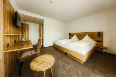 Ein Bett oder Betten in einem Zimmer der Unterkunft Beim Mühlenwirt
