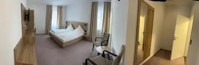 Ein Bett oder Betten in einem Zimmer der Unterkunft Beim Mühlenwirt