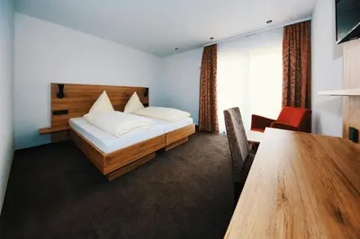 Ein Bett oder Betten in einem Zimmer der Unterkunft Beim Mühlenwirt