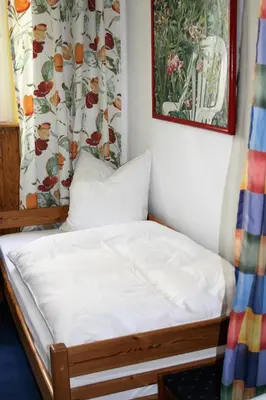 Ein Bett oder Betten in einem Zimmer der Unterkunft Herrenhof