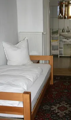 Ein Bett oder Betten in einem Zimmer der Unterkunft Herrenhof