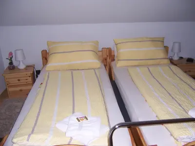 Ein Bett oder Betten in einem Zimmer der Unterkunft Gästehaus Schneider