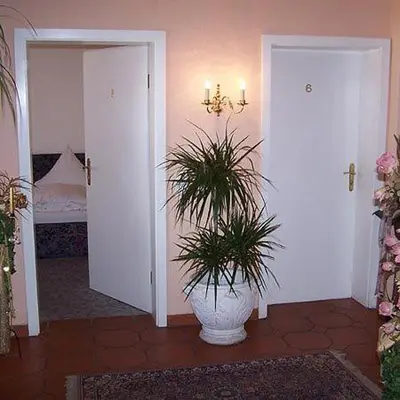 Ein Bett oder Betten in einem Zimmer der Unterkunft Gästehaus Ullmannshof