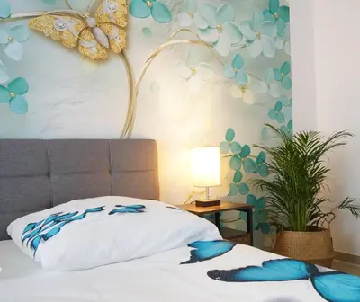 Ein Bett oder Betten in einem Zimmer der Unterkunft Mein Apartment Flowers mit Kamin, bis 10 Personen