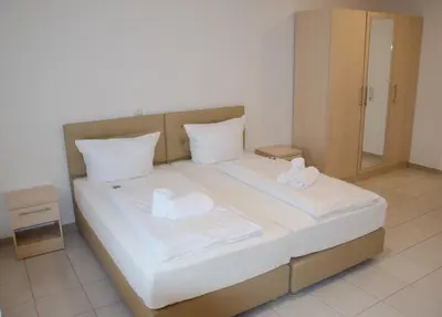 Ein Bett oder Betten in einem Zimmer der Unterkunft Kraichtaler Hof