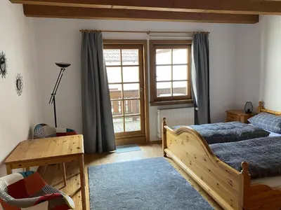 Ein Bett oder Betten in einem Zimmer der Unterkunft Gästehaus Winzerhof Bader