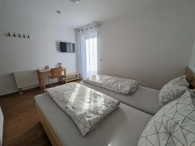 Ein Bett oder Betten in einem Zimmer der Unterkunft Pension Victoria