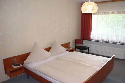 Ein Bett oder Betten in einem Zimmer der Unterkunft Gasthaus Zum Hohenstein