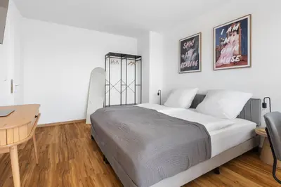 Ein Bett oder Betten in einem Zimmer der Unterkunft Über den Dächern der Stadt - nähe ZKM