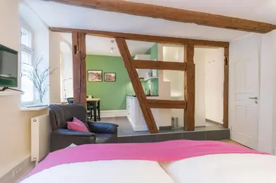 Ein Bett oder Betten in einem Zimmer der Unterkunft Gästehaus am Marktbrunnen
