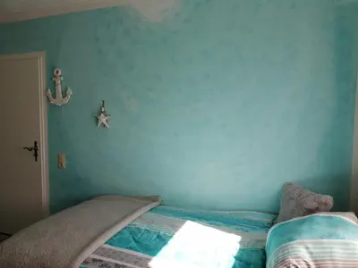 Ein Bett oder Betten in einem Zimmer der Unterkunft Ferienhaus Elwetritsche in Landau/Pfalz