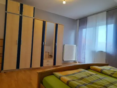 Ein Bett oder Betten in einem Zimmer der Unterkunft Ferienwohnung am Schoosberg, Niederkirchen bei Deidesheim