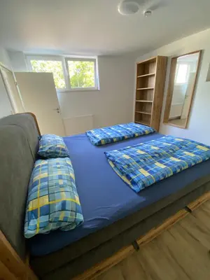 Ein Bett oder Betten in einem Zimmer der Unterkunft Ferienwohnung Sattelkammer