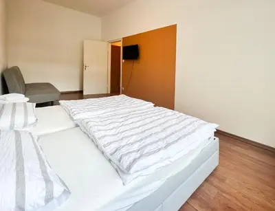 Ein Bett oder Betten in einem Zimmer der Unterkunft Bezaubernde Wohnung in zentraler Lage