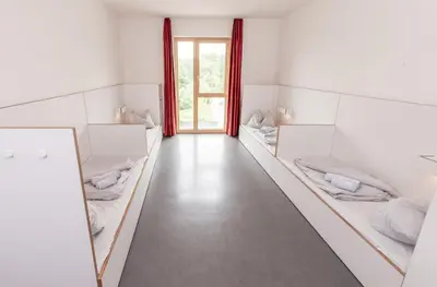 Ein Bett oder Betten in einem Zimmer der Unterkunft Jugendherberge Heilbronn