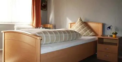 Ein Bett oder Betten in einem Zimmer der Unterkunft Gasthaus Pension Schumbert