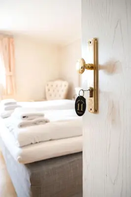 Ein Bett oder Betten in einem Zimmer der Unterkunft Hotel Leone d´Oro