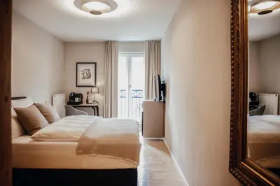 Ein Bett oder Betten in einem Zimmer der Unterkunft Villa Bosco - Boutiquehotel