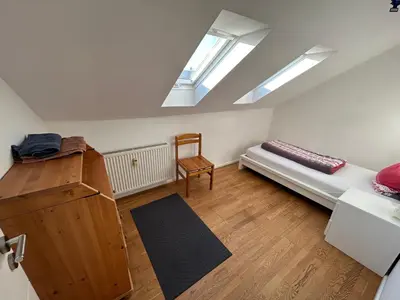 Ein Bett oder Betten in einem Zimmer der Unterkunft XL Apartment Rödermark 4SZ