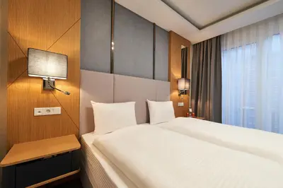 Ein Bett oder Betten in einem Zimmer der Unterkunft WENS Hotel
