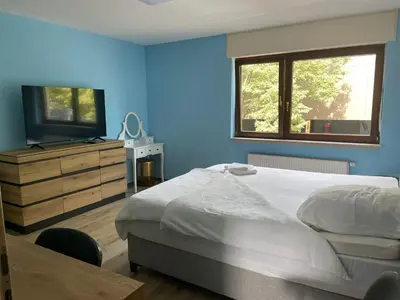 Ein Bett oder Betten in einem Zimmer der Unterkunft Cafe Hotel centrum