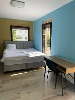 Ein Bett oder Betten in einem Zimmer der Unterkunft Cafe Hotel centrum