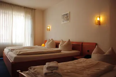 Ein Bett oder Betten in einem Zimmer der Unterkunft Hotel Kurfürst Garni