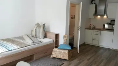 Ein Bett oder Betten in einem Zimmer der Unterkunft Business Apartments Heilbronn