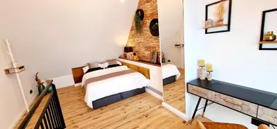Ein Bett oder Betten in einem Zimmer der Unterkunft Stilvolle Maisonette Wohnung