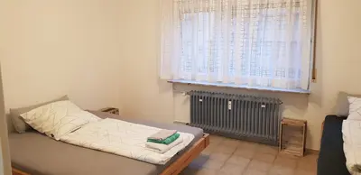 Ein Bett oder Betten in einem Zimmer der Unterkunft Joanna Apartment - Schwetzingen 2