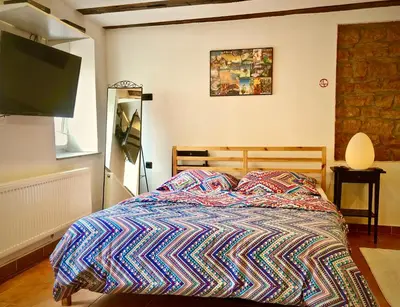 Ein Bett oder Betten in einem Zimmer der Unterkunft C&A Apartments