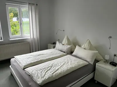 Ein Bett oder Betten in einem Zimmer der Unterkunft Gästehaus Lena