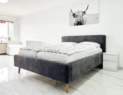 Ein Bett oder Betten in einem Zimmer der Unterkunft Modernes Apartment mit Stil in City Lage