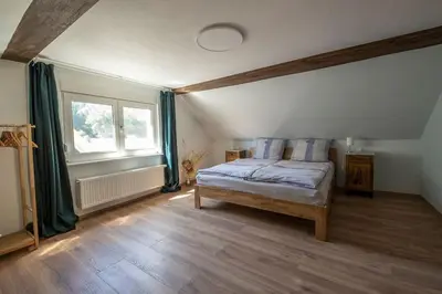 Ein Bett oder Betten in einem Zimmer der Unterkunft Ferienhaus Zum Waldrand