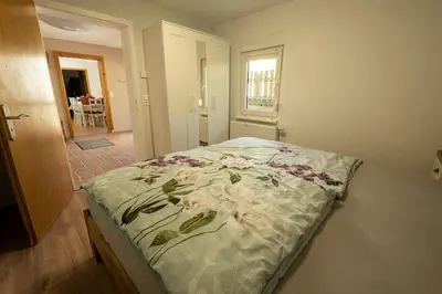 Ein Bett oder Betten in einem Zimmer der Unterkunft Ferienhaus Zum Waldrand