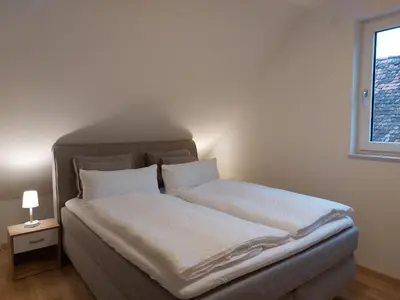 Ein Bett oder Betten in einem Zimmer der Unterkunft Gasthaus Goldener Stern