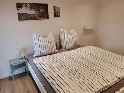 Ein Bett oder Betten in einem Zimmer der Unterkunft Bürgstadt, Am Bischof mit Sonnenterrasse, 1 bis 4 Betten