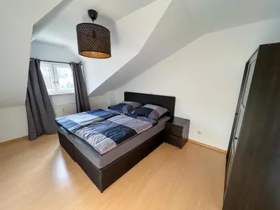 Ein Bett oder Betten in einem Zimmer der Unterkunft Casa Sali - stilvolle Ferienwohnung bei Heidelberg mit Terrasse & Parkplatz