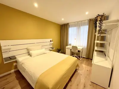 Ein Bett oder Betten in einem Zimmer der Unterkunft Goldstadt Apartments Pforzheim