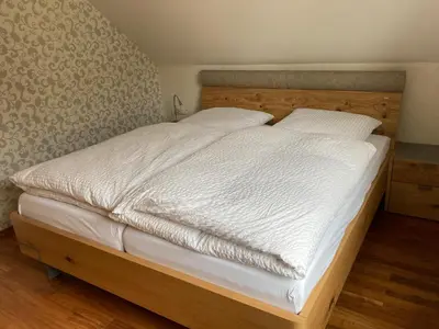 Ein Bett oder Betten in einem Zimmer der Unterkunft Ferienwohnung Rosengarten