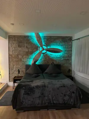 Ein Bett oder Betten in einem Zimmer der Unterkunft Propeller Gästehaus EG