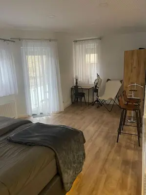 Ein Bett oder Betten in einem Zimmer der Unterkunft Propeller Gästehaus EG
