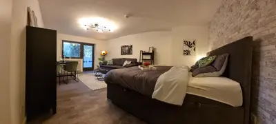 Ein Bett oder Betten in einem Zimmer der Unterkunft Tolle Wohnung im Industrial Style mit Parkplatz